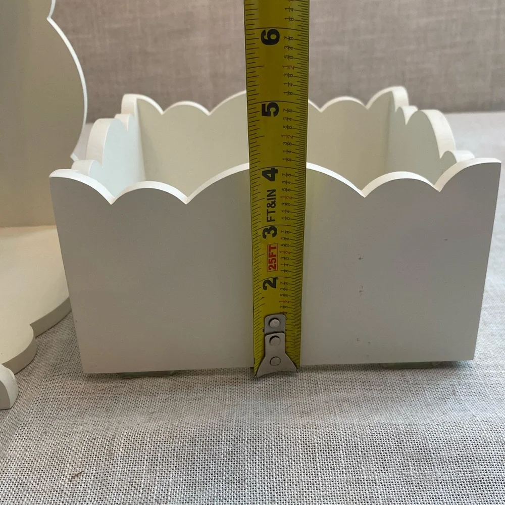 Two wall hanging white shadow boxes.